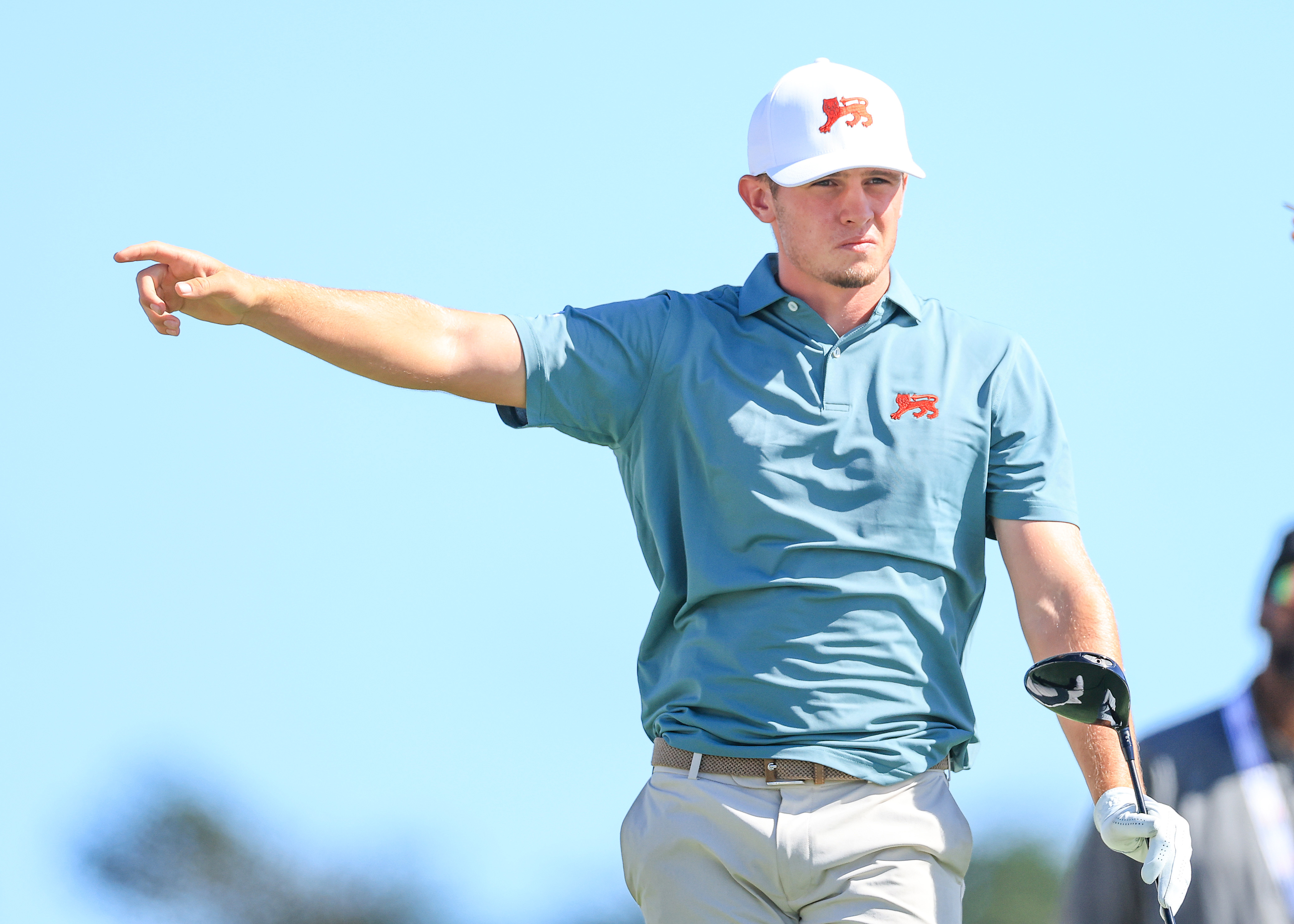 Tyler Weaver playing his tee shot on the 13th hole.