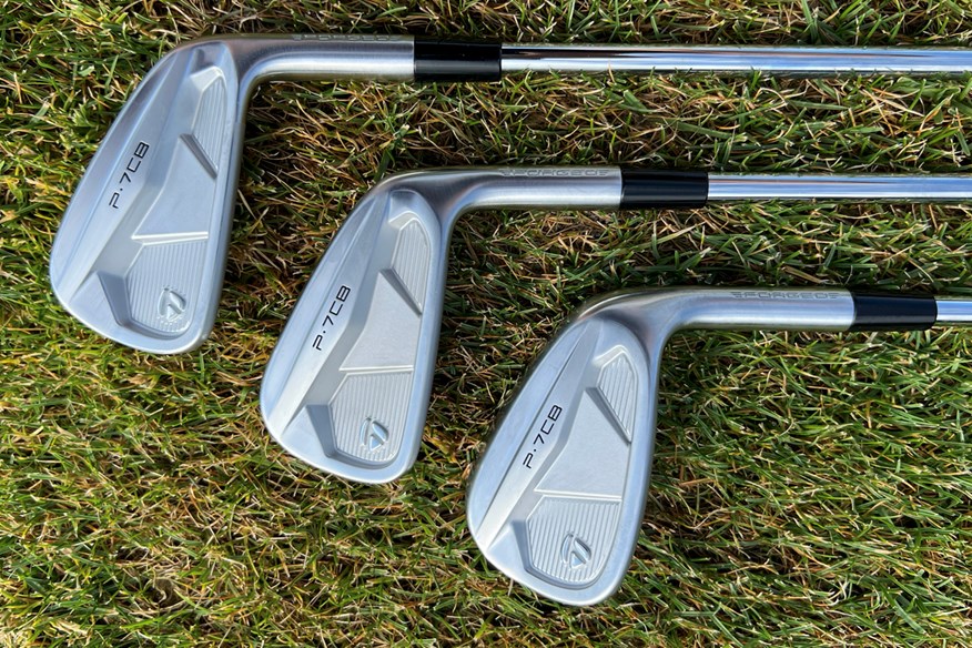 The backs of the TaylorMade P7CB 5, 7 and 9 irons.