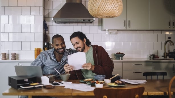 a couple looking at bills