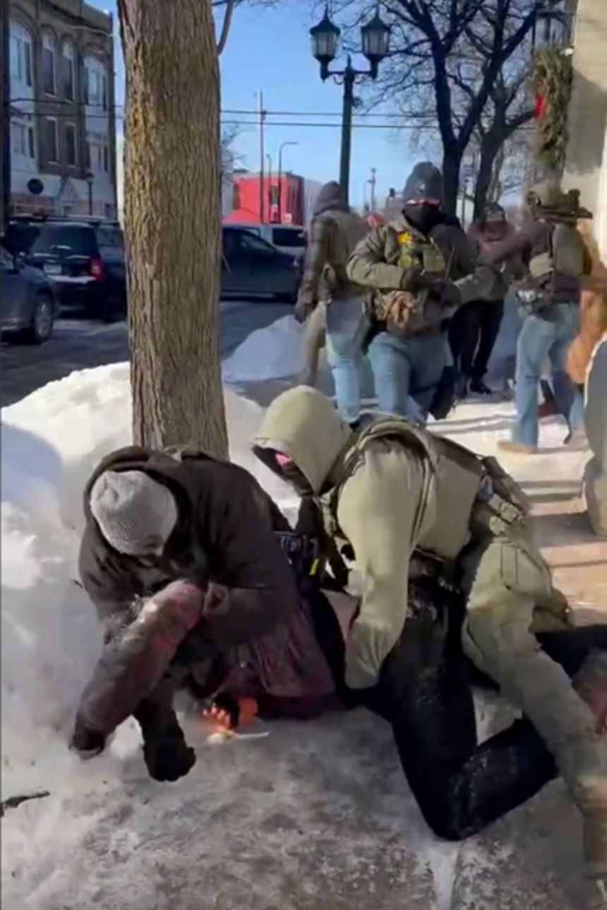 Juan remembered hearing his wife's screams as agents tackled someone to the ground on Saturday. This screenshot is from the video she took.