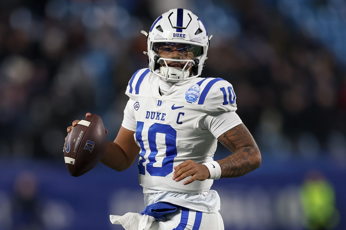 Darian Mensah rolls out of the pocket