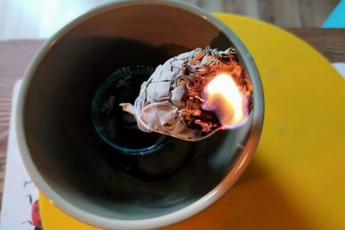 Sage stick burning