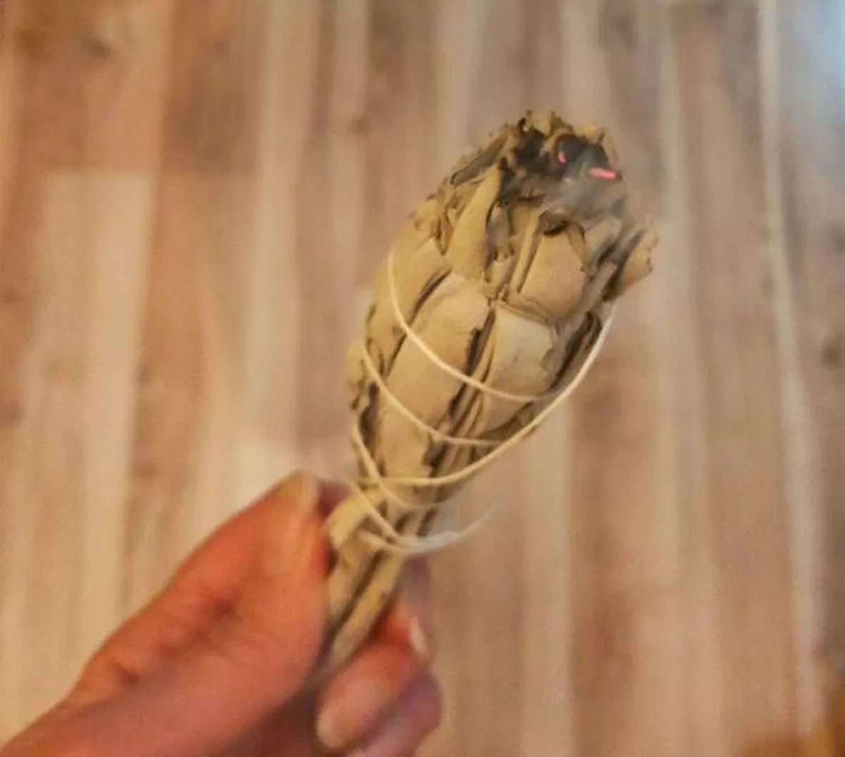 Sage stick in Katie's hand