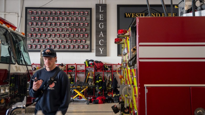 At Station 1 in Westland, Mich., gear lines the walls beneath a “Legacy” sign honoring firefighters who’ve served the department. 