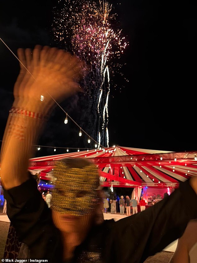 The Rolling Stones frontman sported a leopard print mask for the evening along with a black shirt and matching trousers