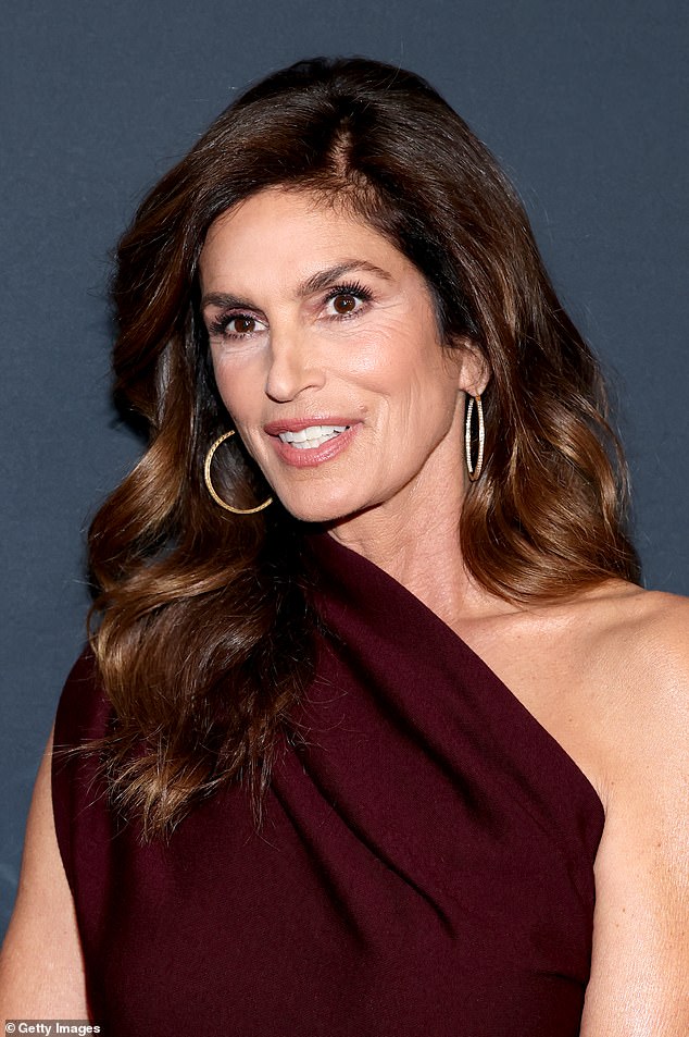 The 59-year-old beauty wore her brunette hair in a voluminous style