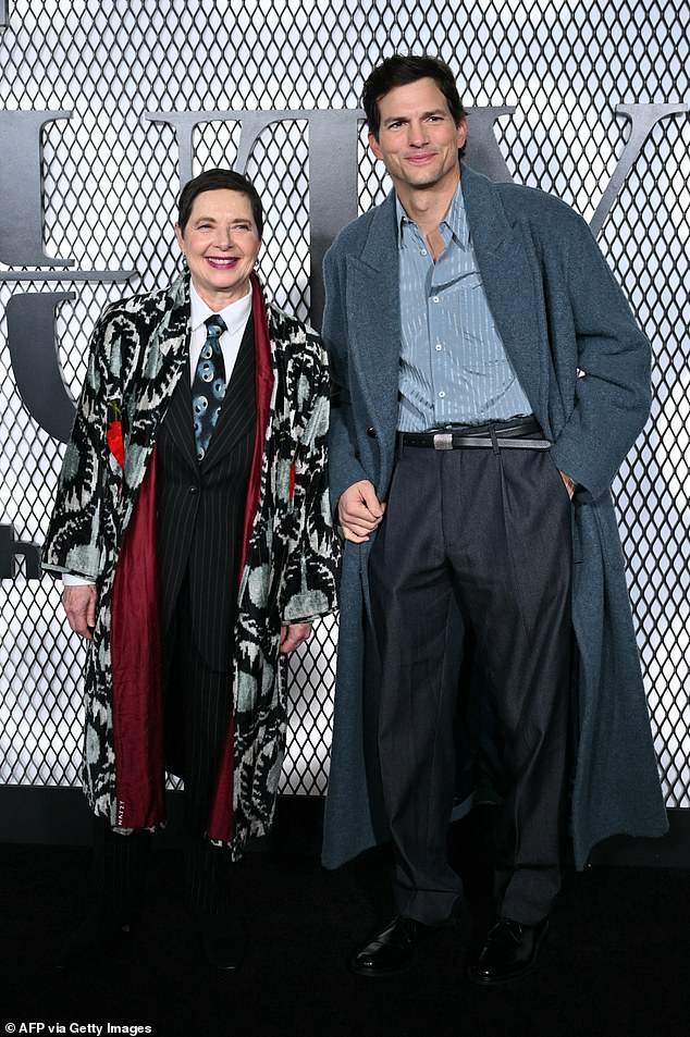 Rossellini's look included a silky robe, quirky tie and classic black vest and trousers