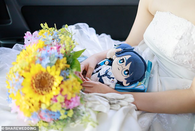 A woman poses with her fictional husband. Photo courtesy of Share Wedding