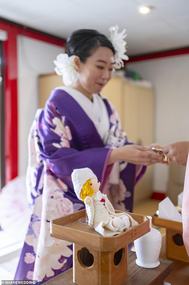 A woman 'marrying' her fictional partner. Photo courtesy of Share Wedding