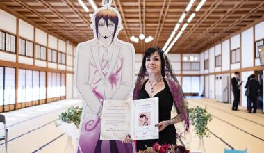 Dis with a cardboard cutout of Mephisto Pheles, a character from a manga series, on their 'wedding day'. Photo courtesy of Dis and Share Wedding