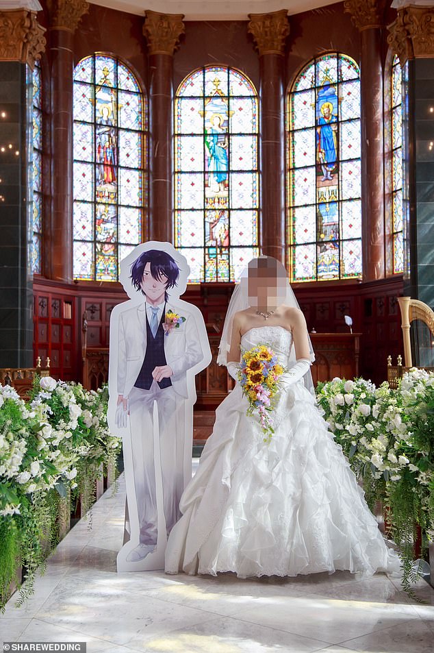 Himari (not her real name) on her 'wedding day' with manga character Yushi Oshitari. Photo courtesy of Share Wedding