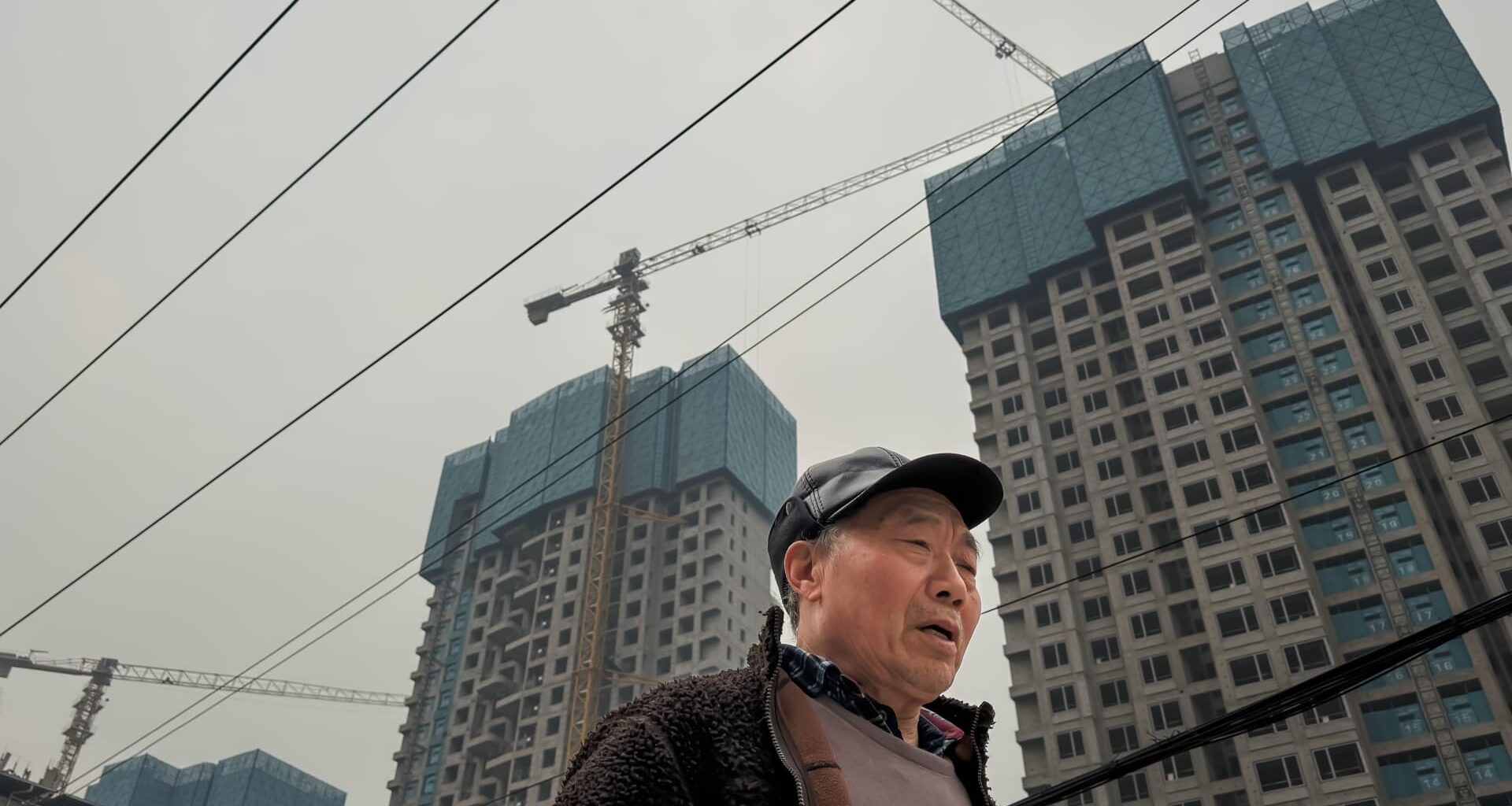 China's investment crash raises credit risks for homebuilders, banks, government: Fitch