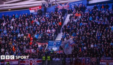 Rangers fans at the Estadio do Dragao, with a number of flags visible among the crowd