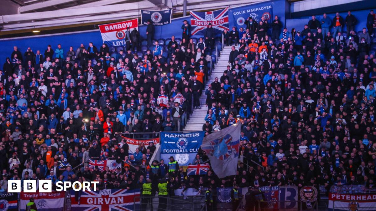 Rangers fans at the Estadio do Dragao, with a number of flags visible among the crowd