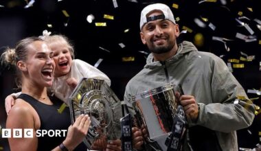 Aryna Sabalenka and Nick Kyrgios hug at the net