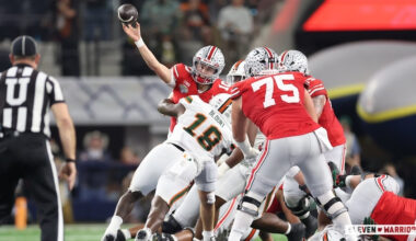 Julian Sayin getting hit as he throws by Miami’s Armondo Blount
