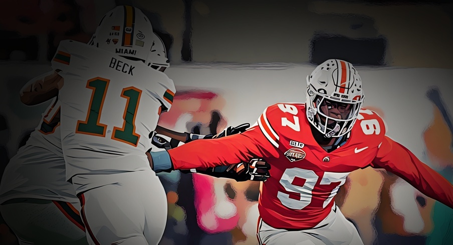 Ohio State Buckeyes defensive end Kenyatta Jackson Jr. (97) pursues Miami Hurricanes quarterback Carson Beck (11) during the Cotton Bowl at AT&T Stadium in Arlington, Texas for the College Football Playoff quarterfinal game on Dec. 31, 2025. Ohio State lost 24-14.