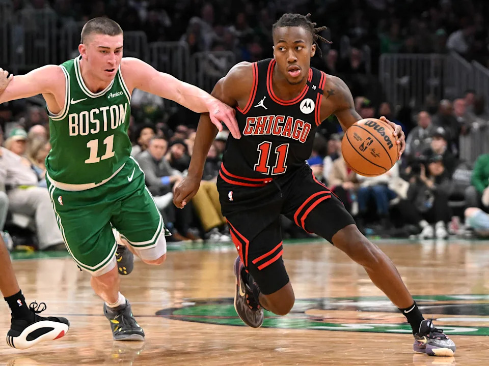BOSTON, MASSACHUSETTS - JANUARY 29: Ayo Dosunmu #11 of the Chicago Bulls dribbles the ball to the basket against Payton Pritchard #11 of the Boston Celtics during the fourth quarter at the TD Garden on January 29, 2025 in Boston, Massachusetts. NOTE TO USER: User expressly acknowledges and agrees that, by downloading and or using this photograph, User is consenting to the terms and conditions of the Getty Images License Agreement. (Photo by Brian Fluharty/Getty Images)