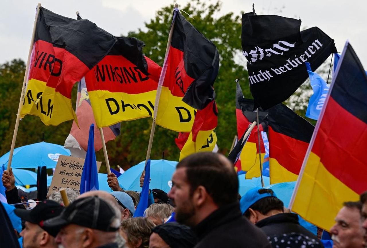 Protesters hold German flags with "We are the people" written on them during a rally of far-right groups, including the Alternative for Germany (AfD) party, in Berlin, Oct. 8, 2022. (AFP Photo)