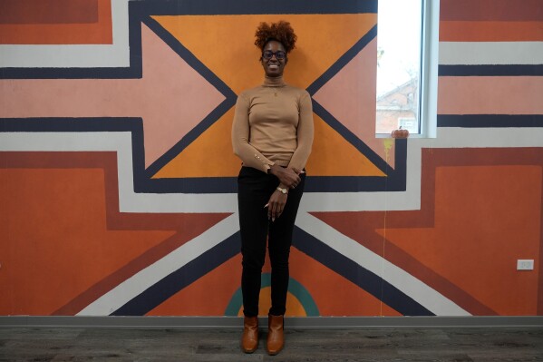 Former Minnesota Lynx forward Devereaux Peters, transitioned from basketball to real estate development, poses for a photo at her office in Chicago, Monday, Nov. 24, 2025. (AP Photo/Erin Hooley)