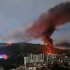 Fire at Fuerte Tiuna, Venezuela's largest military complex, is seen from a distance after a series of explosions in Caracas on Saturday.