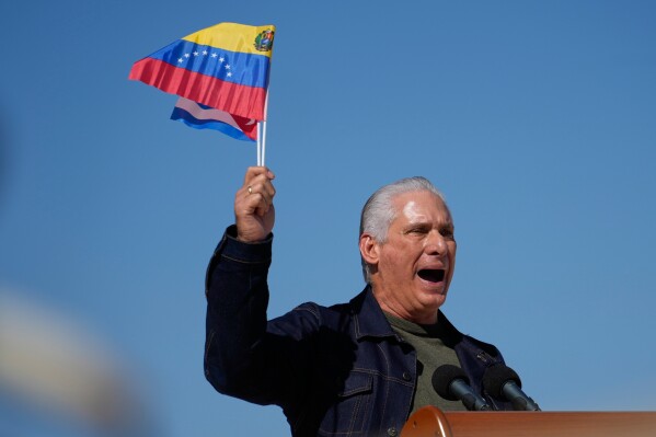 Cuban President Miguel Diaz-Canel attends a rally in Havana, Cuba, Saturday, Jan. 3, 2026, in solidarity with Venezuela after the U.S. captured President Nicolas Maduro and flew him out of Venezuela. (AP Photo/Ramon Espinosa)