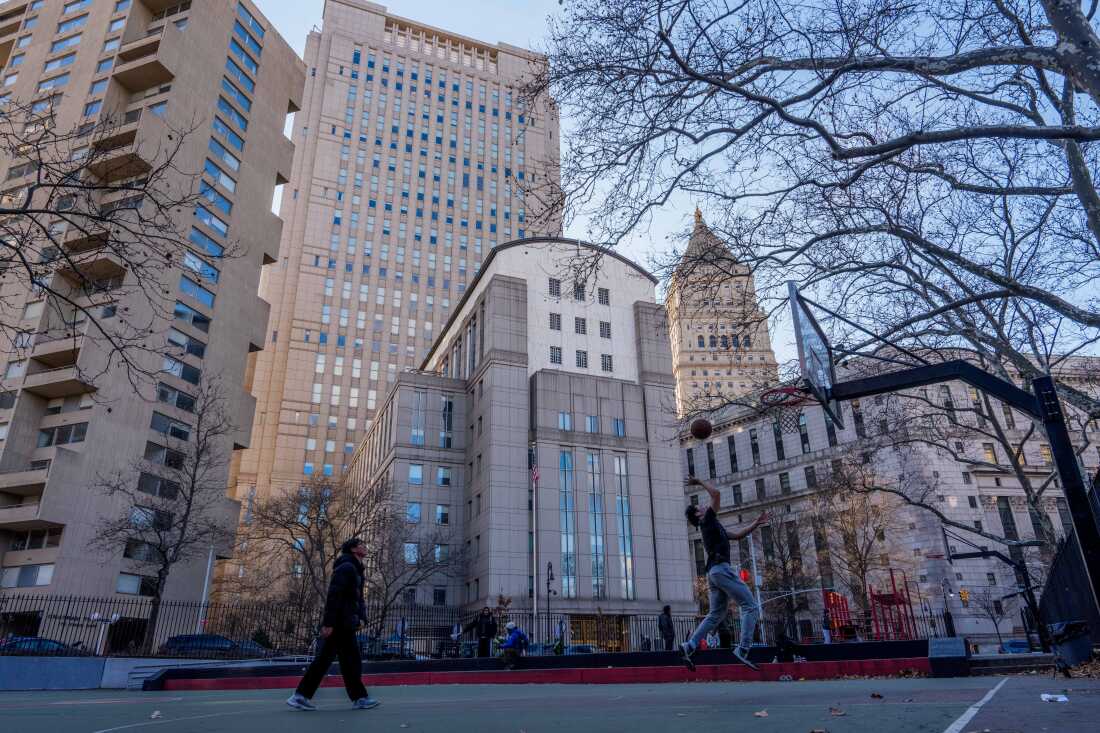 People play basketball in front of Daniel Patrick Moynihan United States Courthouse in New York City on Sunday. Maduro is set to make his first court appearance on Monday.