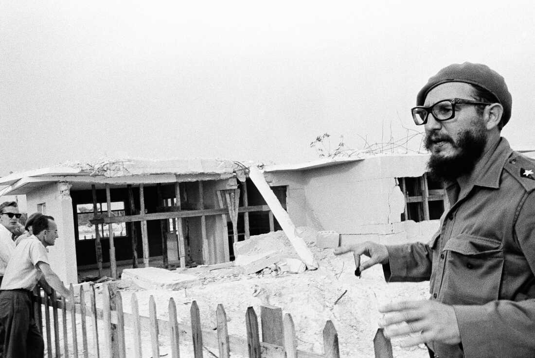 Fidel Castro points out damaged cottages at Playa Giron on June 16, 1961.