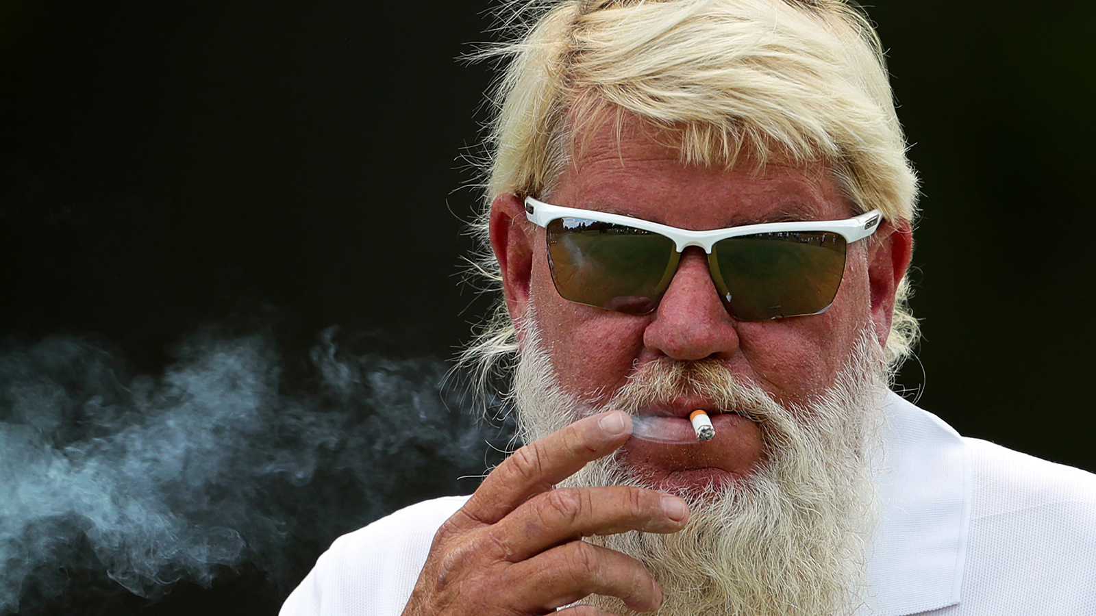 John Daly smoking a cigarette