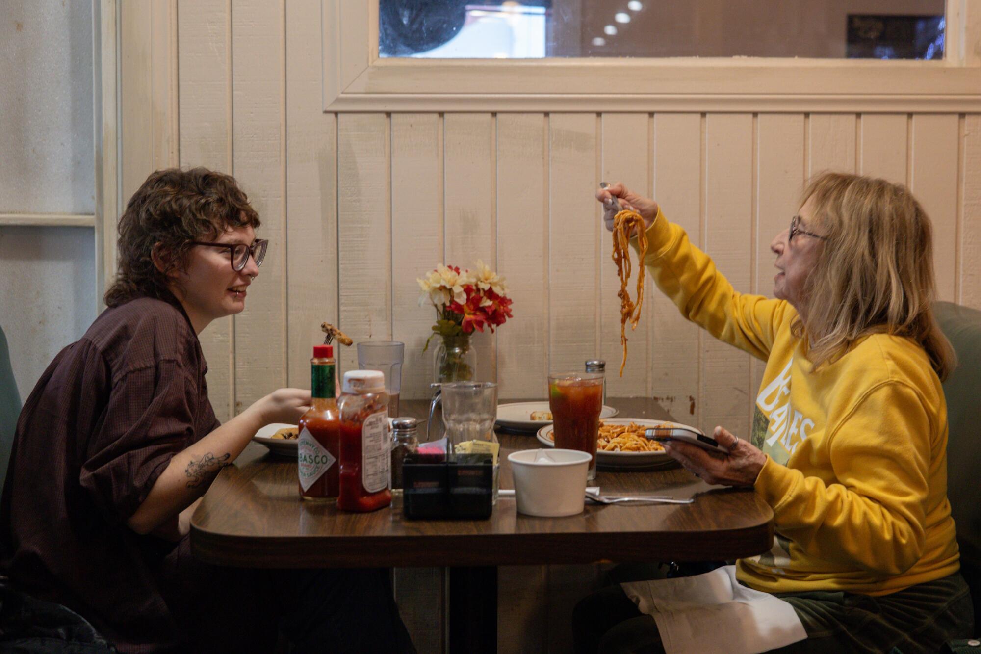 Charlane Glover, right, and her granddaughter Kylie Glover, left, share a meal at the Original Saugus Cafe.