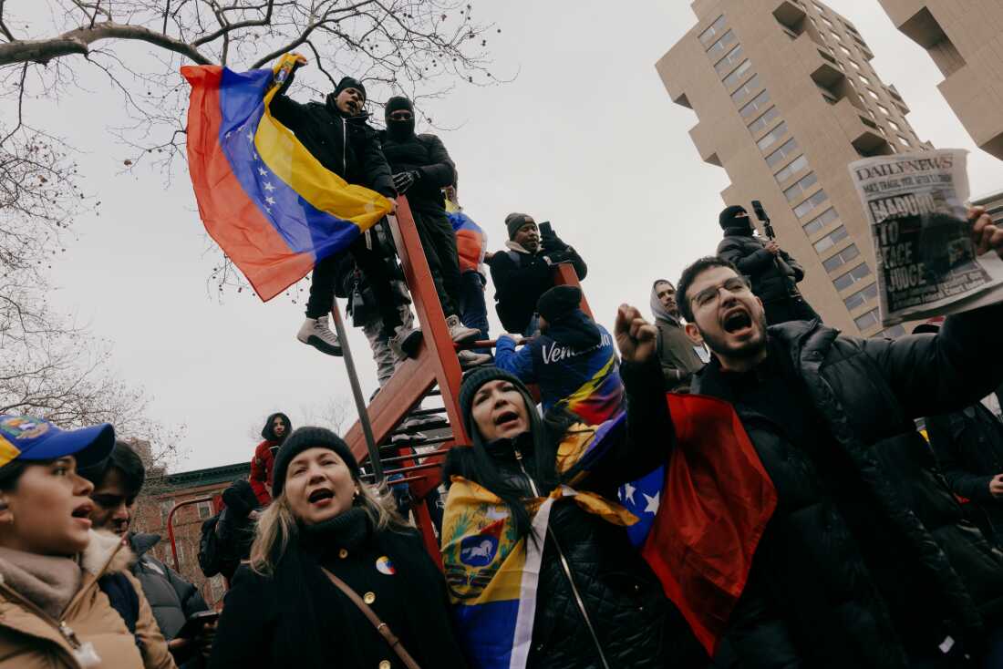 Anti-Maduro demonstrators fly Venezuelan flags outside the federal courthouse in Lower Manhattan, New York, on Monday, January 5.