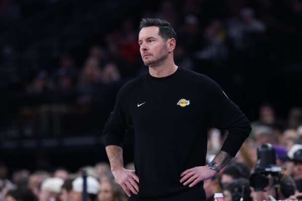 Los Angeles Lakers head coach JJ Redick looks on during the first quarter of an NBA basketball game against the Utah Jazz, Thursday, Dec. 18, 2025, in Salt Lake City. (AP Photo/Rob Gray)