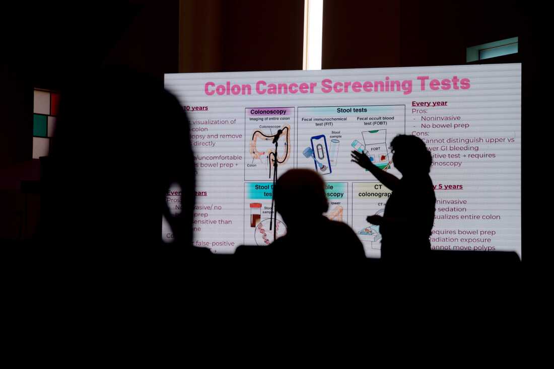Dr. Mary Marfisee and two UCLA medical students lead a cancer awareness talk in the Union Rescue Mission chapel in Los Angeles, educating women residents about cancer prevention and care.