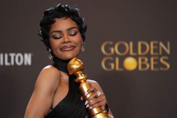 Teyana Taylor poses in the press room with the award for best performance by a female actor in a supporting role in any motion picture for "One Battle After Another" during the 83rd Golden Globes on Sunday, Jan. 11, 2026, at the Beverly Hilton in Beverly Hills, Calif. (AP Photo/Chris Pizzello)