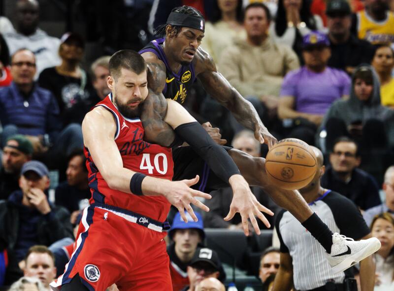 Lakers forward Jarred Vanderbilt battles Zubac for a rebound in the second half.
