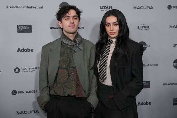 Director Aidan Zamiri, left, and Charli xcx attend the premiere of "The Moment" during the Sundance Film Festival on Friday, Jan. 23, 2026, at Eccles Center in Park City, Utah. (AP Photo/Chris Pizzello)