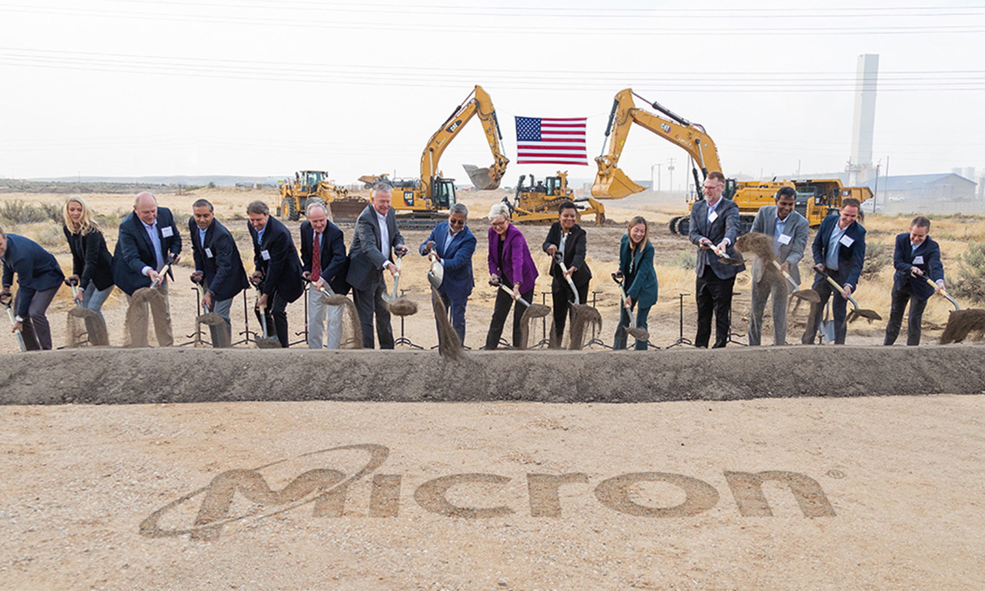 A team from Micron Technology breaks ground on a construction project.
