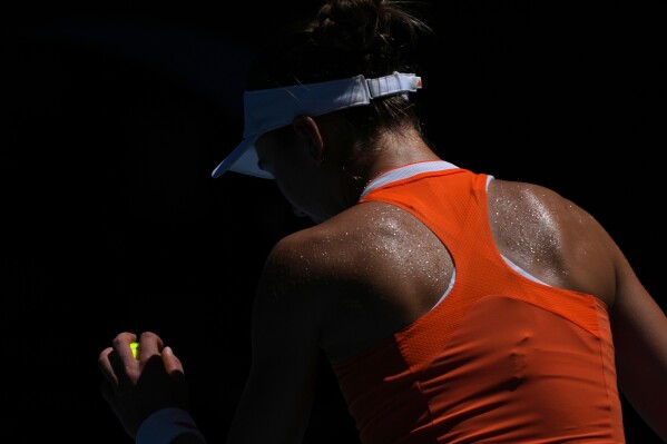 Iva Jovic of the U.S. prepares to serve to Aryna Sabalenka of Belarus during their quarterfinal match at the Australian Open tennis championship in Melbourne, Australia, Tuesday, Jan. 27, 2026. (AP Photo/Dar Yasin)