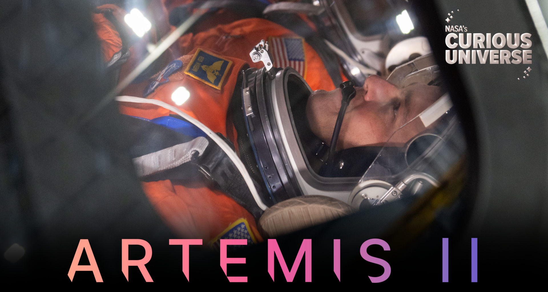 Close-up image of Reid Wiseman, Artemis II commander, wearing an orange spacesuit and clear helmet. The words "Artemis II" are across the bottom of the image and the Curious Universe logo is in the upper right corner.
