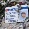 Flowers and candles make up a memorial to Alex Pretti on Jan. 25 in Minneapolis. Pretti, an ICU nurse at a VA medical cente,r, was killed Saturday after being shot multiple times during a brief altercation with border patrol agents in the Eat Street district of Minneapolis.