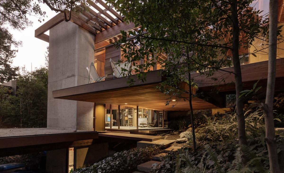 The 4,157-square-foot house is wrapped in concrete, redwood and glass.