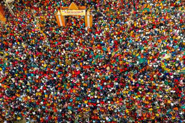 Hindu devotees listen to religious leader Pandit Pradeep Mishra at Satua Baba camp in the Sangam, the confluence of the Ganges, Yamuna and mythical Saraswati rivers, during the annual traditional fair of Magh Mela festival, in Prayagraj, in the northern Indian state of Uttar Pradesh, Tuesday, Jan. 27, 2026. (AP Photo/Rajesh Kumar Singh, File)