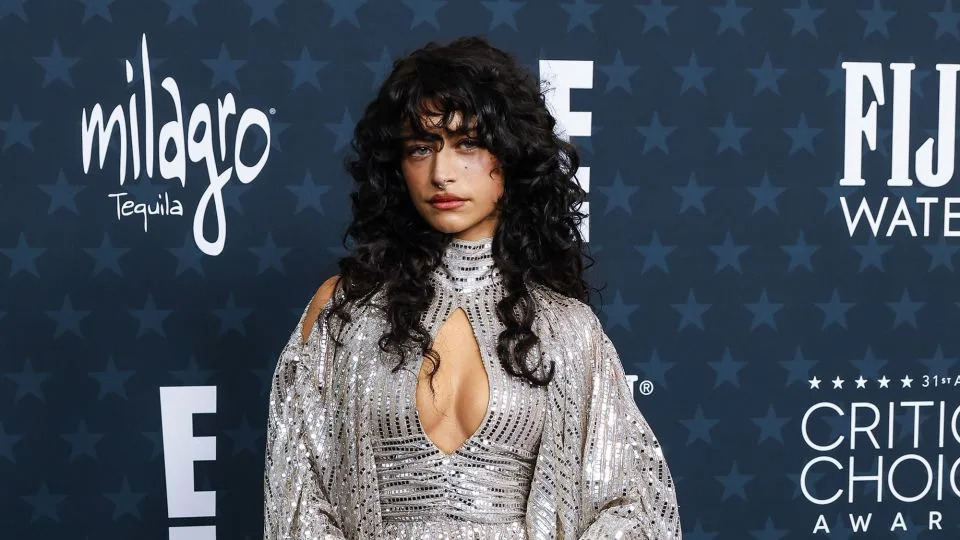 On a night of muted colors and understated styling, “Marty Supreme” star Odessa A’zion broke the mold in a sparkling, maximalist gown by OTT. - Corine Solberg/Sipa USA