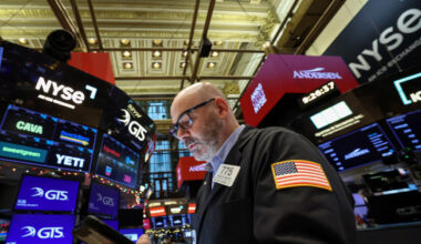 Traders work on the floor of the NYSE in New York