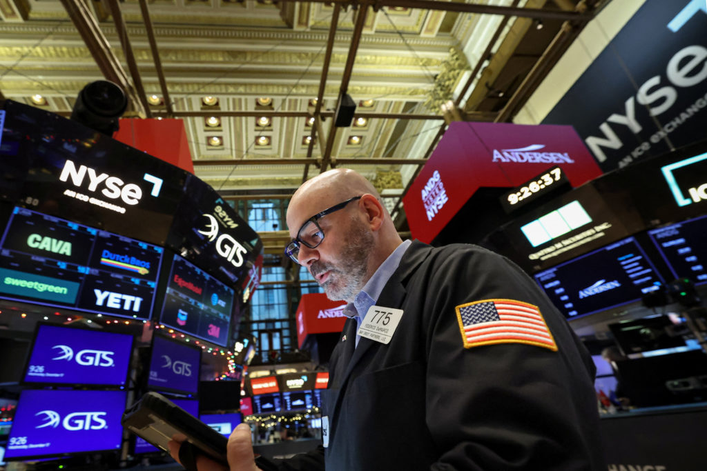 Traders work on the floor of the NYSE in New York