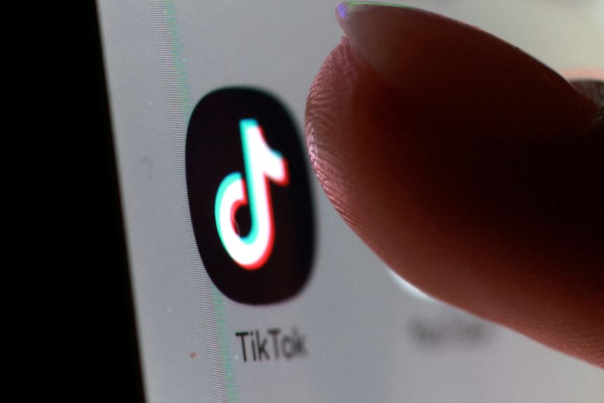 The TikTok app icon on a smartphone on October 27, 2025.