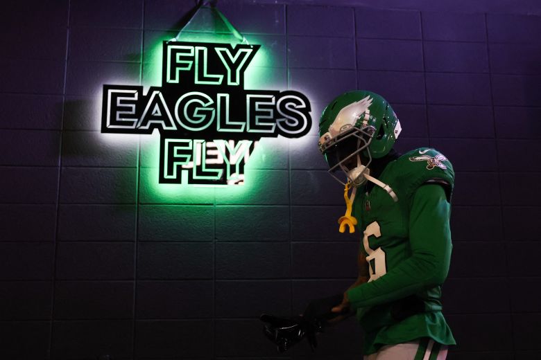 Eagles wide receiver Devonta Smith walks by the sign before a game on January 4.
