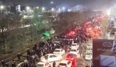 People gather on the streets during a protest in Mashhad