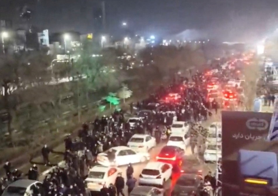 People gather on the streets during a protest in Mashhad