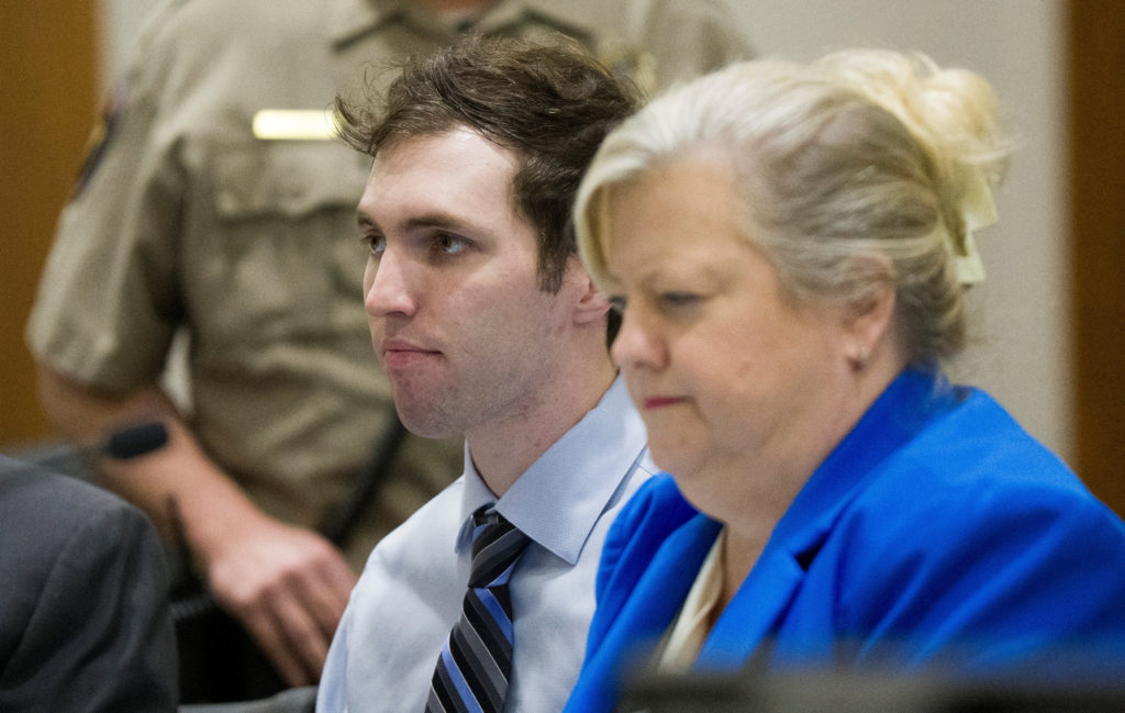 Tyler Robinson, suspect in the fatal shooting of Charlie Kirk, sits beside defense attorney Kathryn Nester